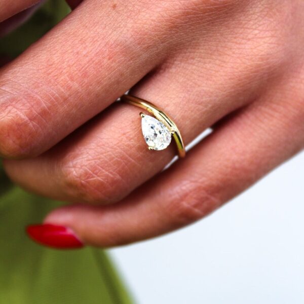 Floating Pear Solitaire Curved Band Engagement Ring