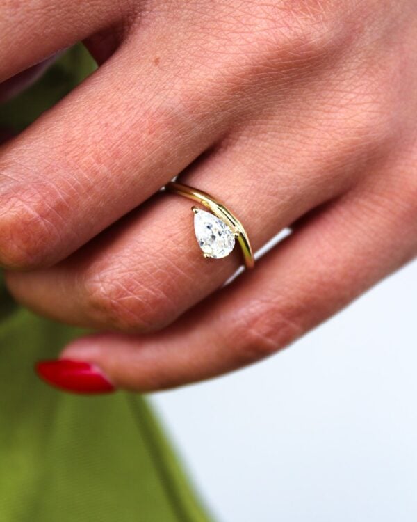 Floating Pear Solitaire Curved Band Engagement Ring