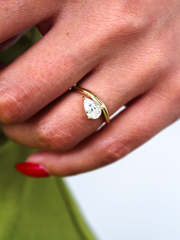 Floating Pear Solitaire Curved Band Engagement Ring