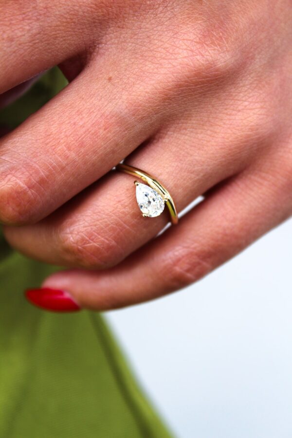 Floating Pear Solitaire Curved Band Engagement Ring