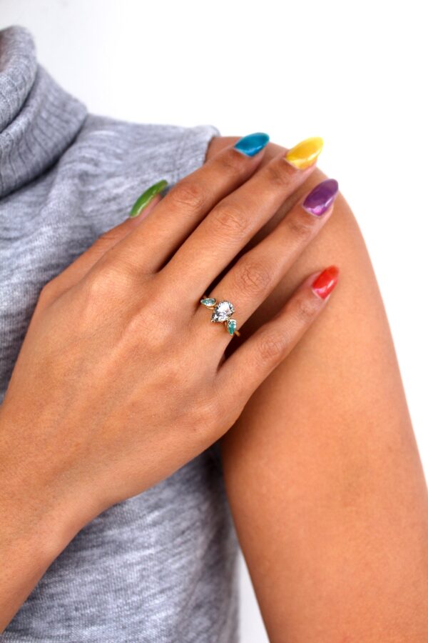 Levi - Grey And Blue Pear Moissanite Trilogy Engagement Ring