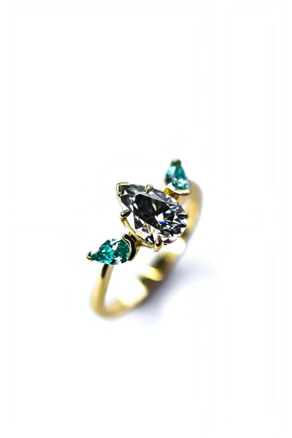 Levi - Grey And Blue Pear Moissanite Trilogy Engagement Ring - Image 4