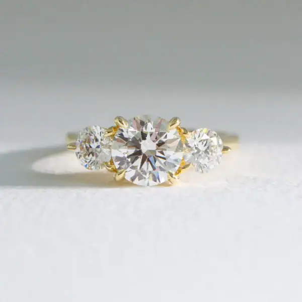 Hidden Halo Round Trilogy Moissanite Engagement Ring