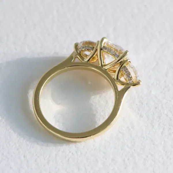Hidden Halo Round Trilogy Moissanite Engagement Rings